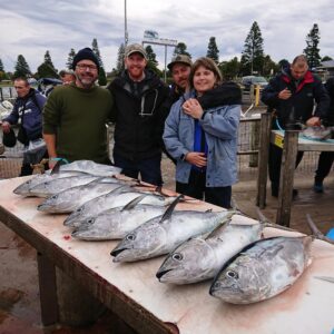 Hadyn, Lucy and Darcy with their daily tuna catch on a fishing trip near Portland