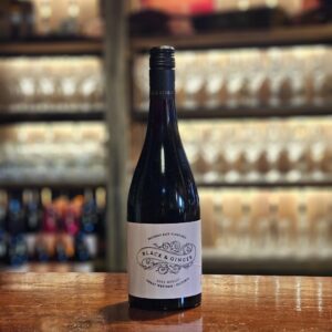 A bottle of merlot on the bar at the wine shed
