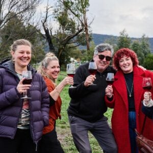 Guests enjoying a glass of wine outside the wine shed during winter solstice