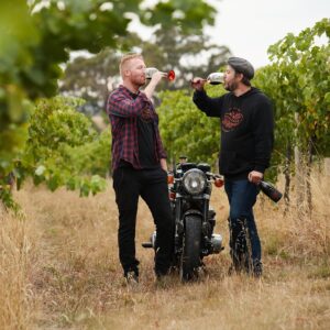 Darcy and Hadyn enjoying a glass of wine in the vineyard